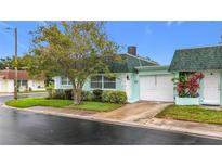 Charming single-story home with a well-manicured lawn and attached garage, perfect for low-maintenance living at 8375 Burgundy N Dr, Pinellas Park, FL 33781