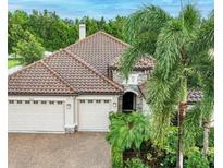 Charming home with a tile roof, two-car garage and beautiful landscaping at 14807 Bowfin Ter, Lakewood Ranch, FL 34202