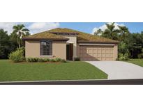 Charming single-story home with a well-maintained lawn, neutral tones, and a two-car garage at 20214 Banner Ave, Port Charlotte, FL 33952