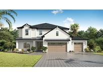 Charming two-story home featuring a 3-car garage, lush landscaping, and a welcoming facade at 3912 W San Rafael St, Tampa, FL 33629