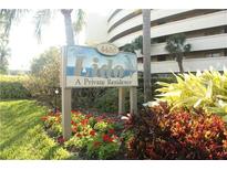A lovely sign welcomes you to The Lido, a private residence, surrounded by lush landscaping at 4450 Gulf Blvd # 110, St Pete Beach, FL 33706