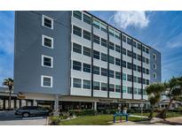 Suncoast Towers building exterior featuring a blue and white facade with well-maintained landscaping at 841 4Th N Ave # 21, St Petersburg, FL 33701