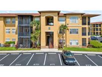 Inviting condo building with well-manicured landscaping and convenient parking at 4306 Bayside Village Dr # 201, Tampa, FL 33615
