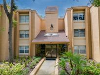 Charming condo building with lush landscaping and welcoming entrance at 4411 Shady Terrace Ln # 213, Tampa, FL 33613