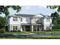 Inviting two-story townhome with charming exterior and well-manicured landscaping at 10717 Wading River Ave, Parrish, FL 34219