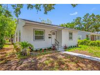 Charming single-story home with a well-maintained stucco exterior, landscaped front yard, and welcoming entrance at 2326 Auburn S St, St Petersburg, FL 33712