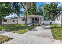 Charming single-story home with a long driveway, neat landscaping, and a welcoming front porch at 2834 10Th N Ave, St Petersburg, FL 33713