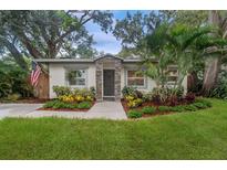 Charming single-story home with stone accents and beautifully landscaped front yard at 3215 W Villa Rosa St, Tampa, FL 33611