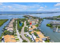 Stunning aerial view of waterfront condos with boat docks and beautiful blue water views at 4202 Harbor House Dr # 24, Tampa, FL 33615