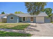 Charming single-story home with a well-maintained lawn and attached one car garage at 5860 99Th N Ave, Pinellas Park, FL 33782