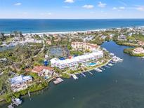 Waterfront condos feature a private pool, boat docks, and lovely gulf views at 615 Dream Island Pl # 210, Longboat Key, FL 34228