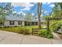 Charming single-story home with a lush front yard and a welcoming walkway at 15234 Scanio Dr, Spring Hill, FL 34610