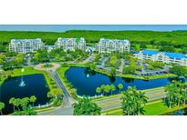 Beautiful condo community with lush landscaping, parking and a pond with fountains at 2333 Feather Sound Dr # B609, Clearwater, FL 33762