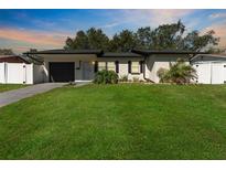 Charming single-story home with a well-manicured lawn, inviting curb appeal, and a freshly painted exterior at 4111 Whiting Se Dr, St Petersburg, FL 33705