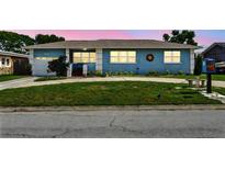 Charming single story home with a large circular driveway and well-manicured lawn at 4211 28Th N Ave, St Petersburg, FL 33713