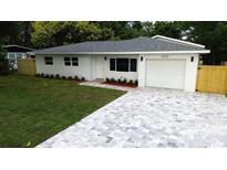 Charming, fully renovated home featuring a stylish driveway and freshly landscaped front yard at 6332 Emerson S Ave, St Petersburg, FL 33707