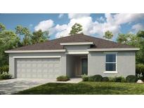 Charming single-story home with a two-car garage and well-maintained landscaping at 13548 Tropical Breeze Way, Hudson, FL 34669