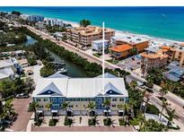 Stunning aerial view of beach condos, featuring boat docks, garages and beach access in Indian Rocks Beach, Florida at 208 Haven Beach Ct, Indian Rocks Beach, FL 33785