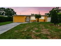 Charming single-story home with a well-manicured lawn and inviting curb appeal at 2818 Lorraine St, Tampa, FL 33614