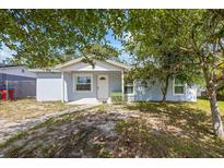 Charming single-story home with a mature tree providing shade in the front yard at 12660 118Th St, Largo, FL 33778