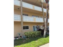 The exterior of the home shows manicured landscaping and a welcoming facade at 2466 Ecuadorian Way # 32, Clearwater, FL 33763