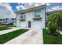 Inviting townhome featuring a private balcony, garage, and well-maintained landscaping at 6206 92Nd N Pl # 3605, Pinellas Park, FL 33782