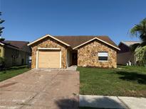 Charming single-story home with stone facade and well-maintained lawn at 1331 Coolmont Dr, Brandon, FL 33511