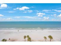 Expansive beach view with turquoise water and sandy shoreline, perfect for relaxation and recreation at 14950 Gulf Blvd # 902, Madeira Beach, FL 33708