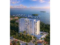 Stunning aerial view of a high-rise condo overlooking a marina and scenic waterfront at 5701 Bowen Daniel Dr. # 806, Tampa, FL 33616