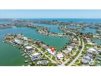 Stunning aerial view of a waterfront neighborhood featuring beautiful homes and access to canals and the open water at 7892 10Th S Ave, St Petersburg, FL 33707