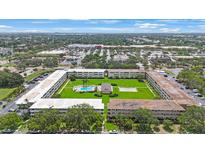 Scenic aerial view of the community featuring a lush green space and a refreshing pool at 8100 Dr Martin Luther King Jr N St # 202, St Petersburg, FL 33702