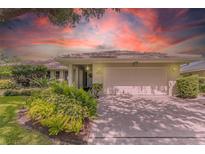 Charming single-story home with a well-manicured lawn, mature landscaping, and a two-car garage at 8515 Macoma Ne Dr, St Petersburg, FL 33702