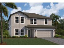 Charming two-story home boasts lush landscaping, a two-car garage, and a welcoming facade at 12801 Castle Oaks Dr, Hudson, FL 34669