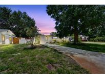 Charming single-story home with a well-maintained lawn and mature trees providing ample shade at 516 Northmoor N Ave, St Petersburg, FL 33702