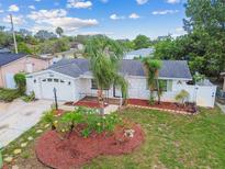 Charming single-story home with well-maintained landscaping, stone facade, and an attached one-car garage at 9011 Hunt Club Ln, Port Richey, FL 34668