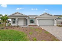 Charming one-story home with a two-car garage and a well-maintained front yard at 16427 Sapphire Point Dr, Lakewood Ranch, FL 34211