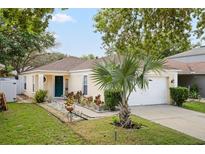 Charming single-story home featuring a welcoming entrance, well-manicured lawn and mature landscaping at 8526 Quarter Horse Dr, Riverview, FL 33578