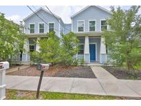 Charming blue two-story home with a welcoming front porch and well-maintained landscaping at 1410 E Curtis St # 2, Tampa, FL 33603
