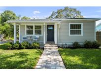 Charming single-story home with a well-manicured lawn and inviting front porch at 4637 4Th N Ave, St Petersburg, FL 33713
