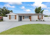 Charming single story home with a spacious driveway and inviting curb appeal at 7107 Limestone Ln, Tampa, FL 33619