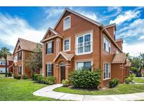 Inviting two-story home with well-manicured lawn and charming architectural details on a beautiful sunny day at 10520 White Lake Ct # 10520, Tampa, FL 33626