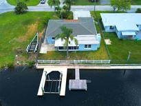 Waterfront home with dock and boat lift access to canal and Gulf of Mexico at 13931 King Ave, Hudson, FL 34667