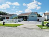 Charming single-story home featuring a well-maintained lawn and driveway at 1918 Crown Park Dr, Valrico, FL 33594