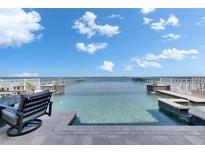 Beautiful waterfront pool and spa overlook the bay, perfect for relaxing and entertaining at 6418 Bright Bay Ct, Apollo Beach, FL 33572