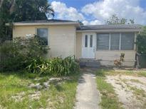 A single Gathering home with a white front door and small front yard at 3110 58Th N Ave, St Petersburg, FL 33714