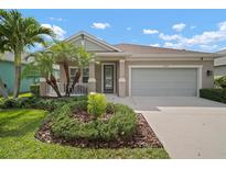 Charming single-story home with a well-manicured lawn and a cozy front porch and a two car garage at 6408 Seasound Dr, Apollo Beach, FL 33572