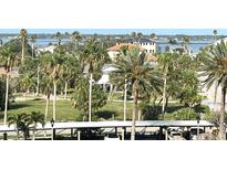 Beautiful community view with palm trees, water views and lovely architecture at 880 Mandalay Ave # C412, Clearwater Beach, FL 33767