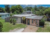 Charming single-story home featuring a quaint brick walkway and mature landscaping at 10549 112Th Ave, Largo, FL 33773