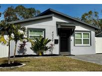Charming single-story home featuring a well-manicured lawn and a freshly painted facade at 4029 9Th S Ave, St Petersburg, FL 33711