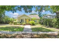 Charming bungalow featuring a well-manicured lawn and inviting front porch at 4220 2Nd N Ave, St Petersburg, FL 33713